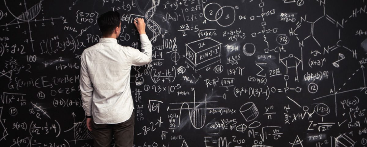 Man solving math equations